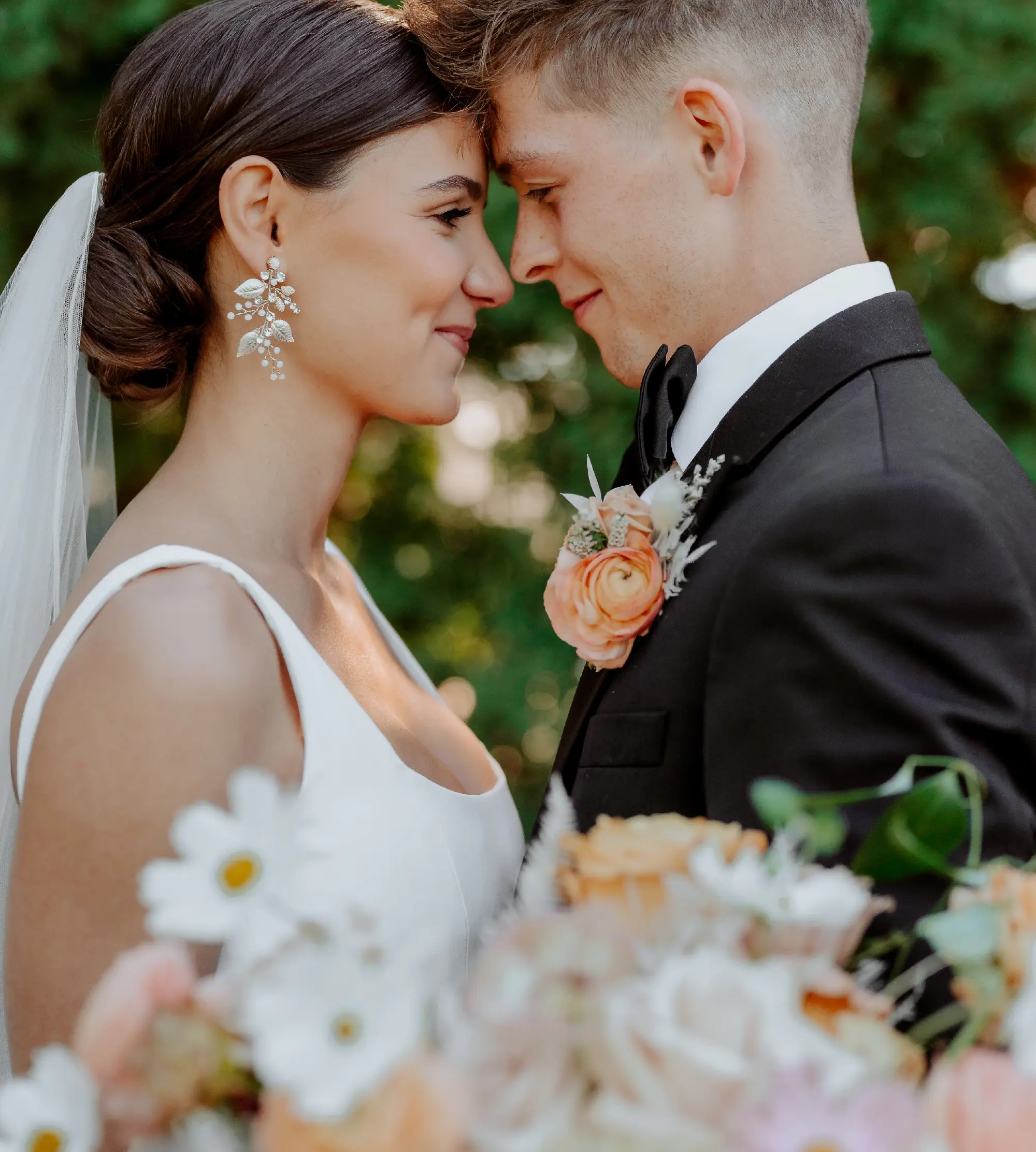 close up of bride and groom touching foreheads