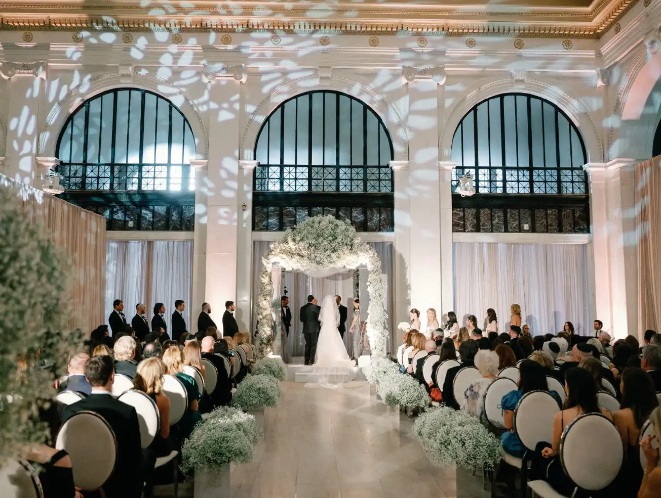 view of down the middle of the aisle with bride and groom