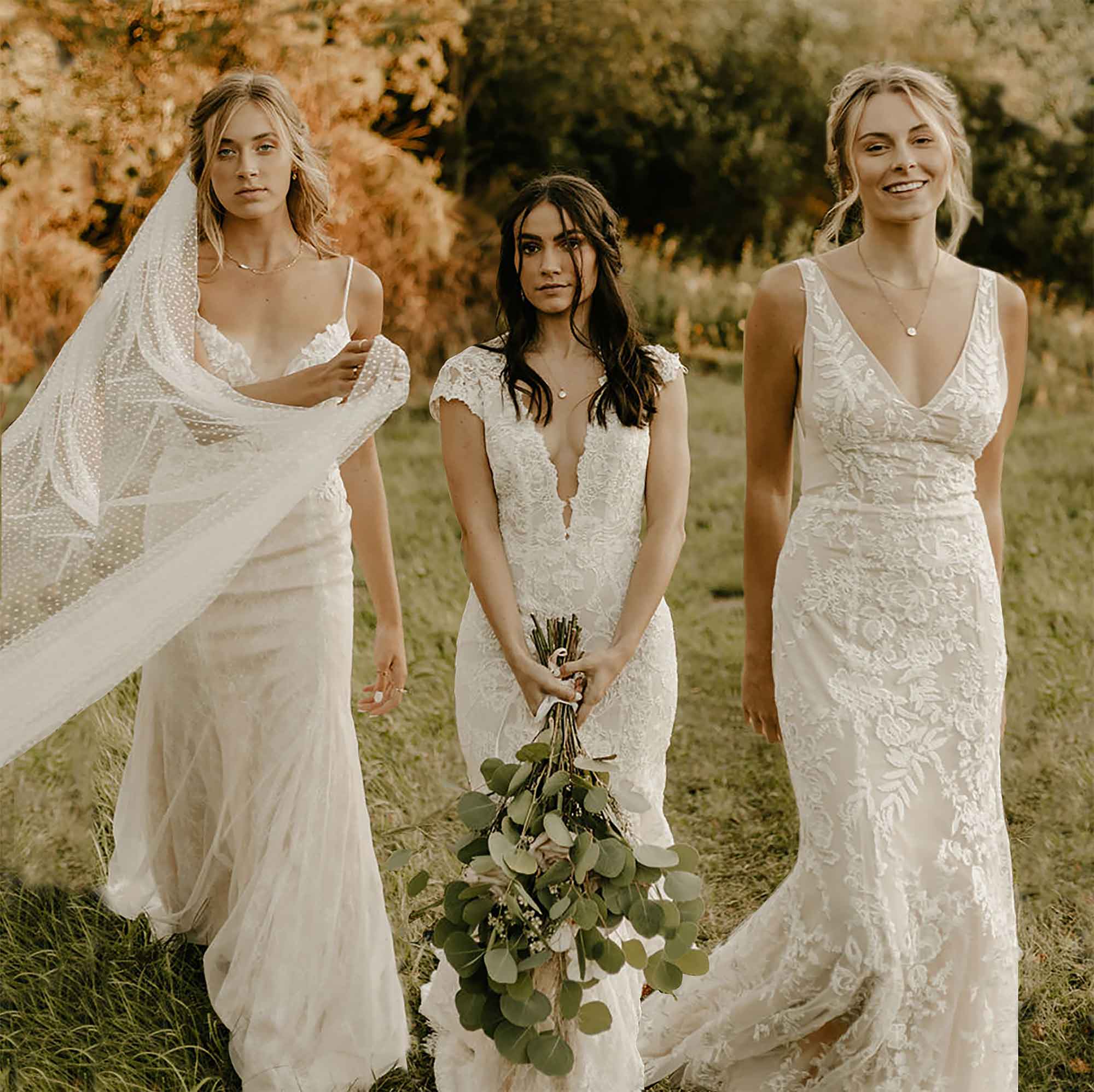 three brides posing for a photo outdoors