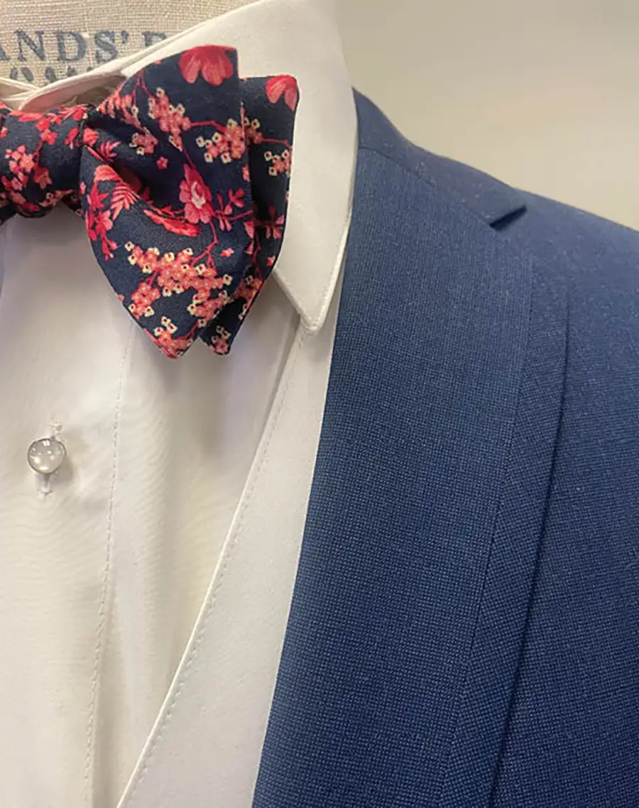 close up image of bowtie and suit collar