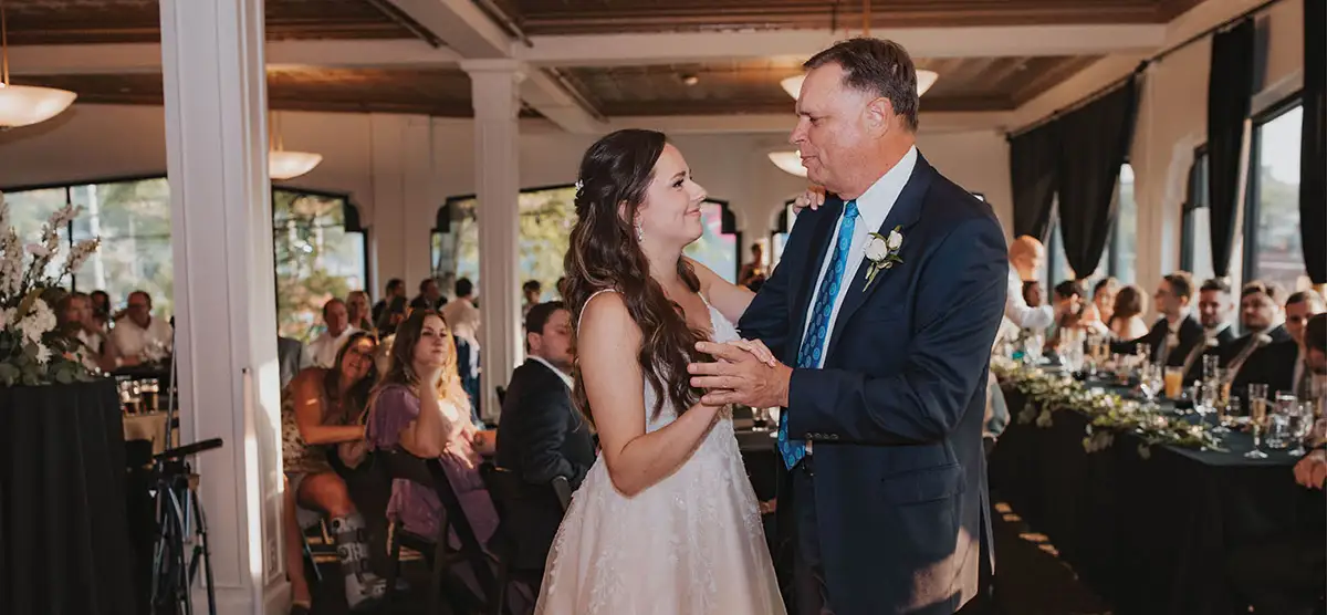 father and daughter dance inside Golden Age at Creston Brewery