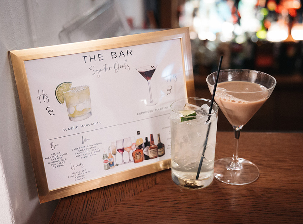 Small bar sign showing signature drinks