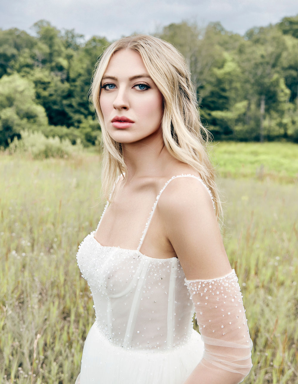 blonde haired female model wearing the Vera Wang Dayana crystal and pearl embellished tulle corset gown