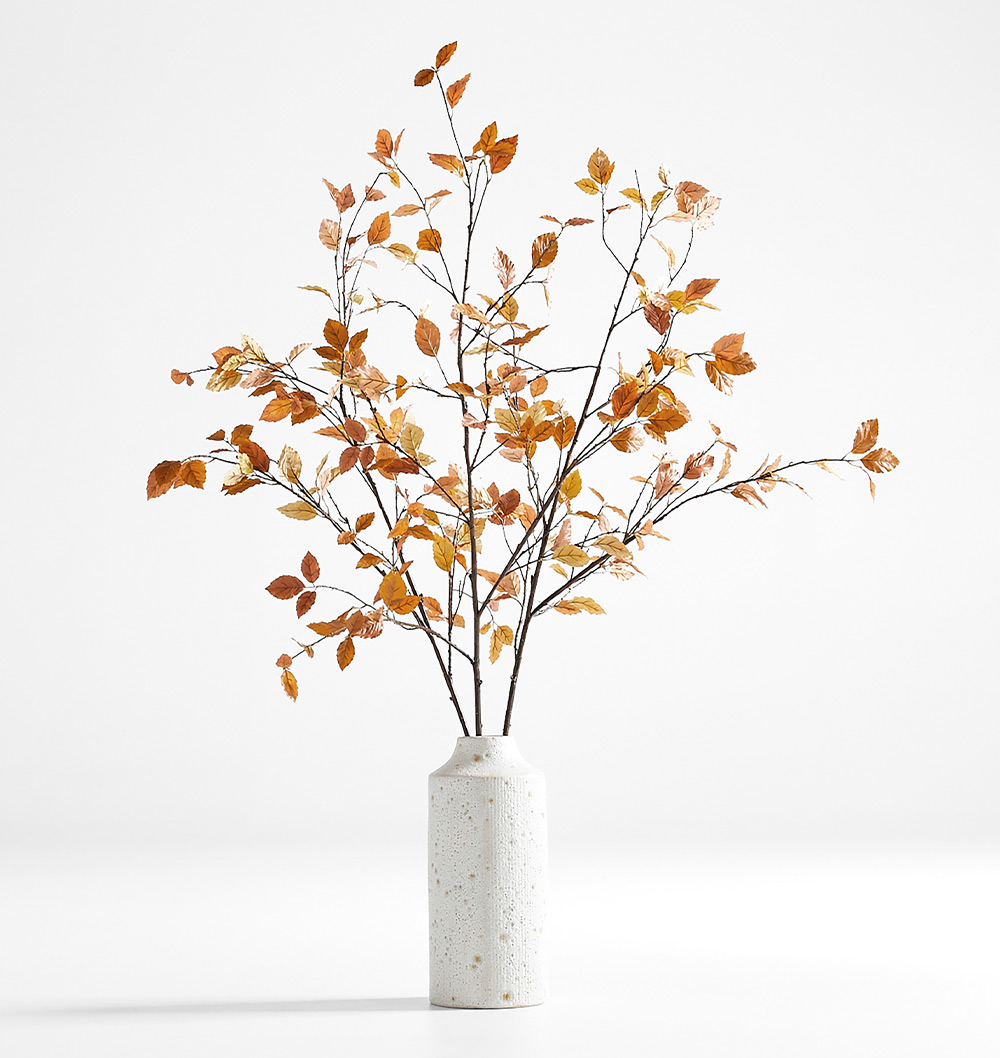 a Faux Golden Yellow Leaf Branch inside of an Ema Ceramic White Floor Vase