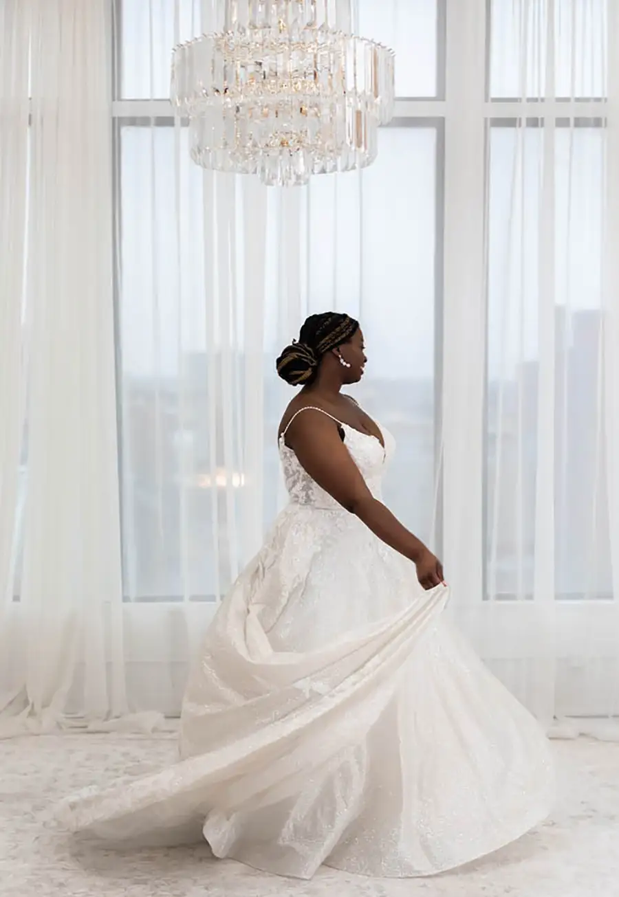 bride shows off different angles of wedding dress