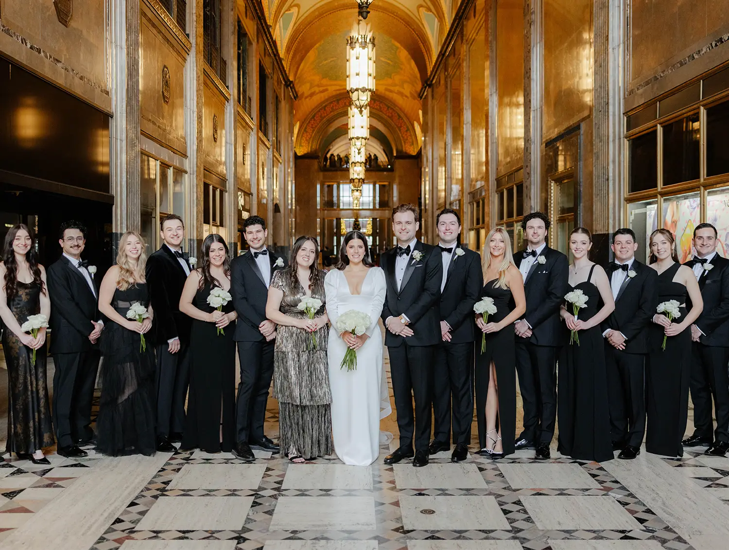Eliza and Daniel posing with bridesmaids and groomsmen