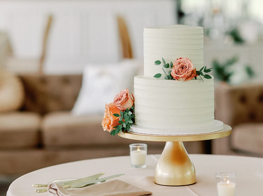 two-tier wedding cake with flower decorations