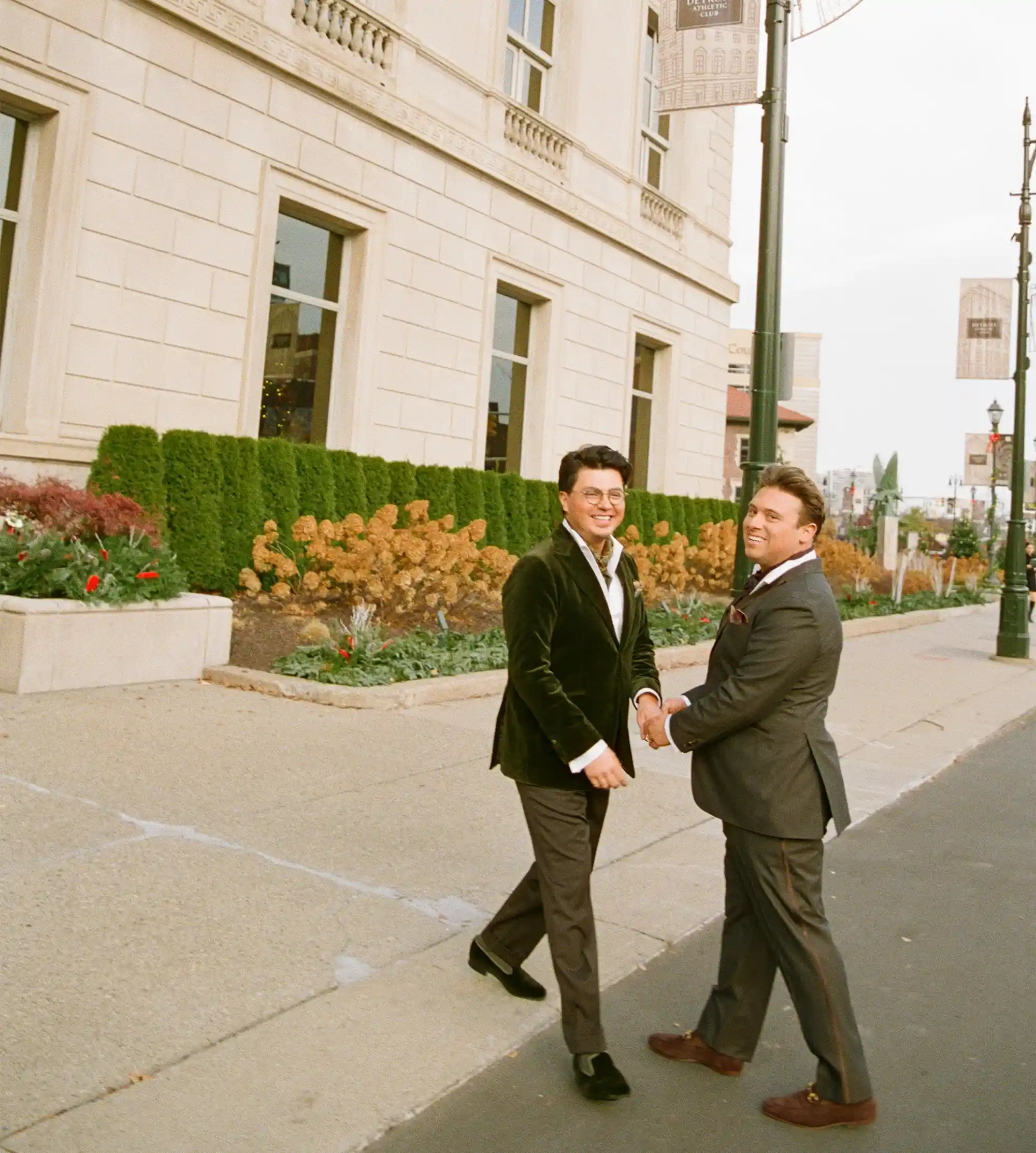 Lou and Vincent smiling together outside the Detroit Athletic Club