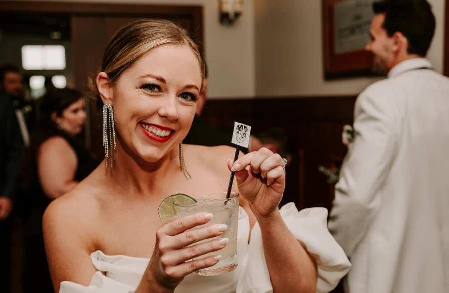 bride smiling with a cocktail