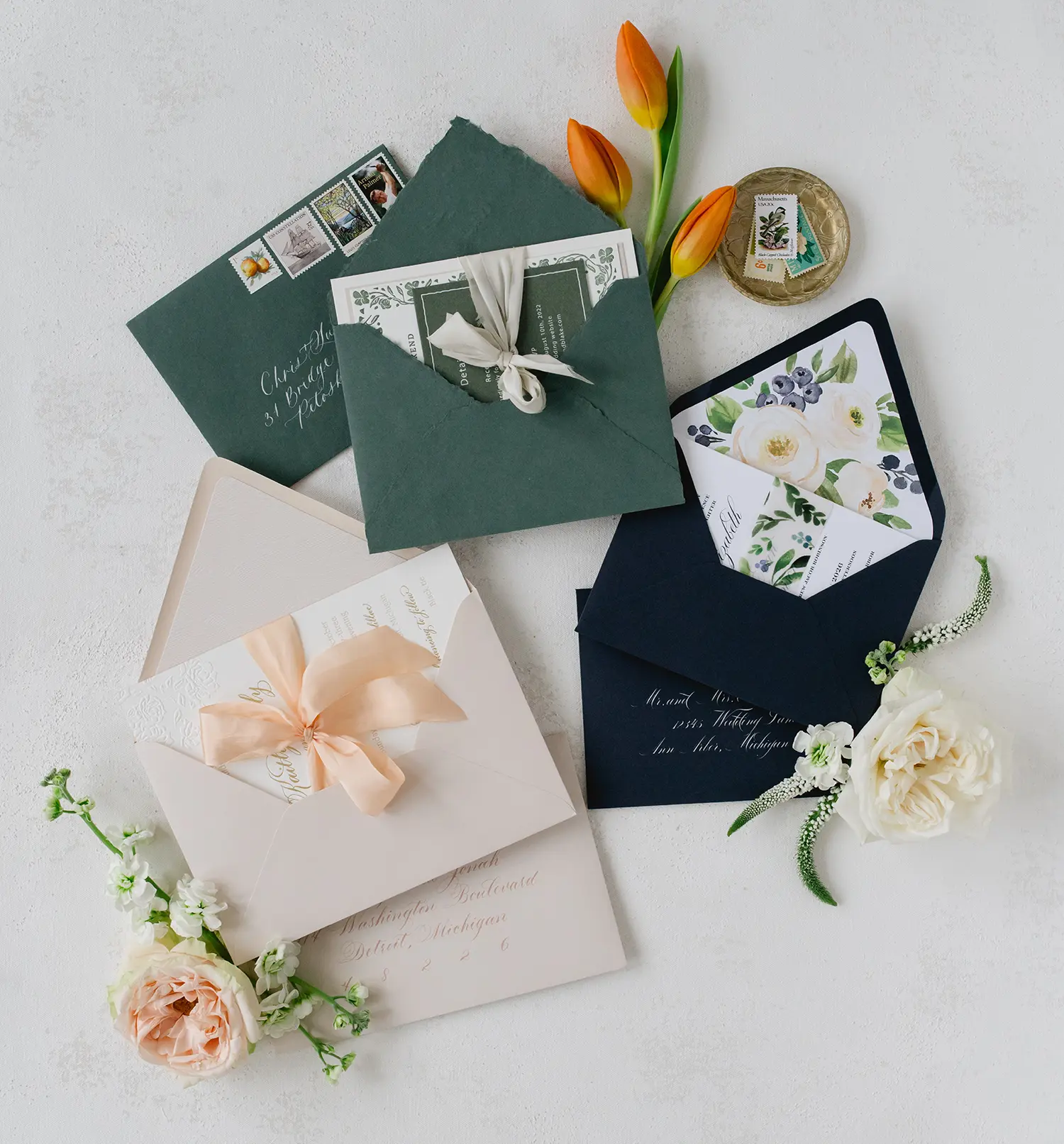 three different wedding invitations