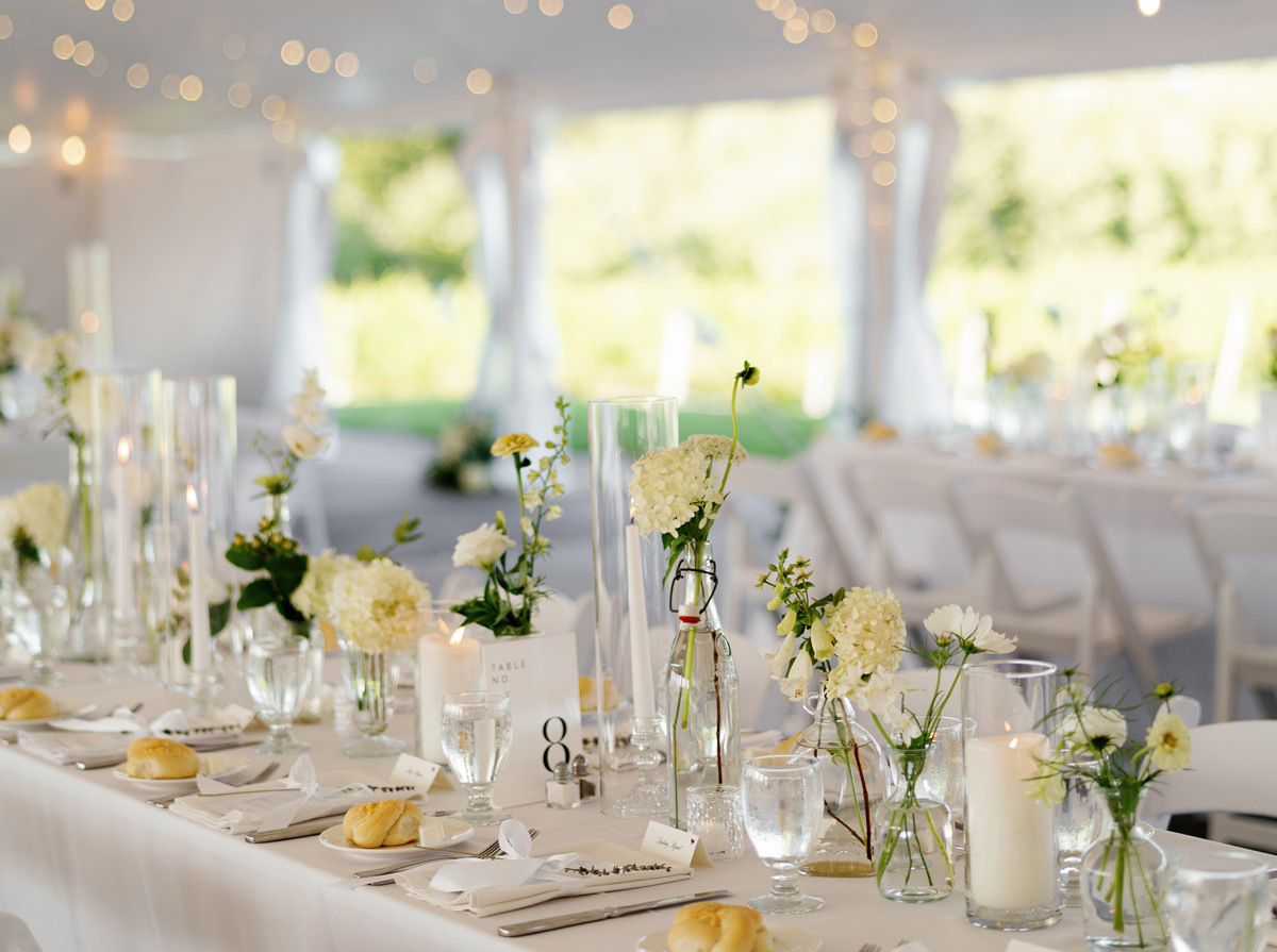 table setup with white flowers and hanging lights